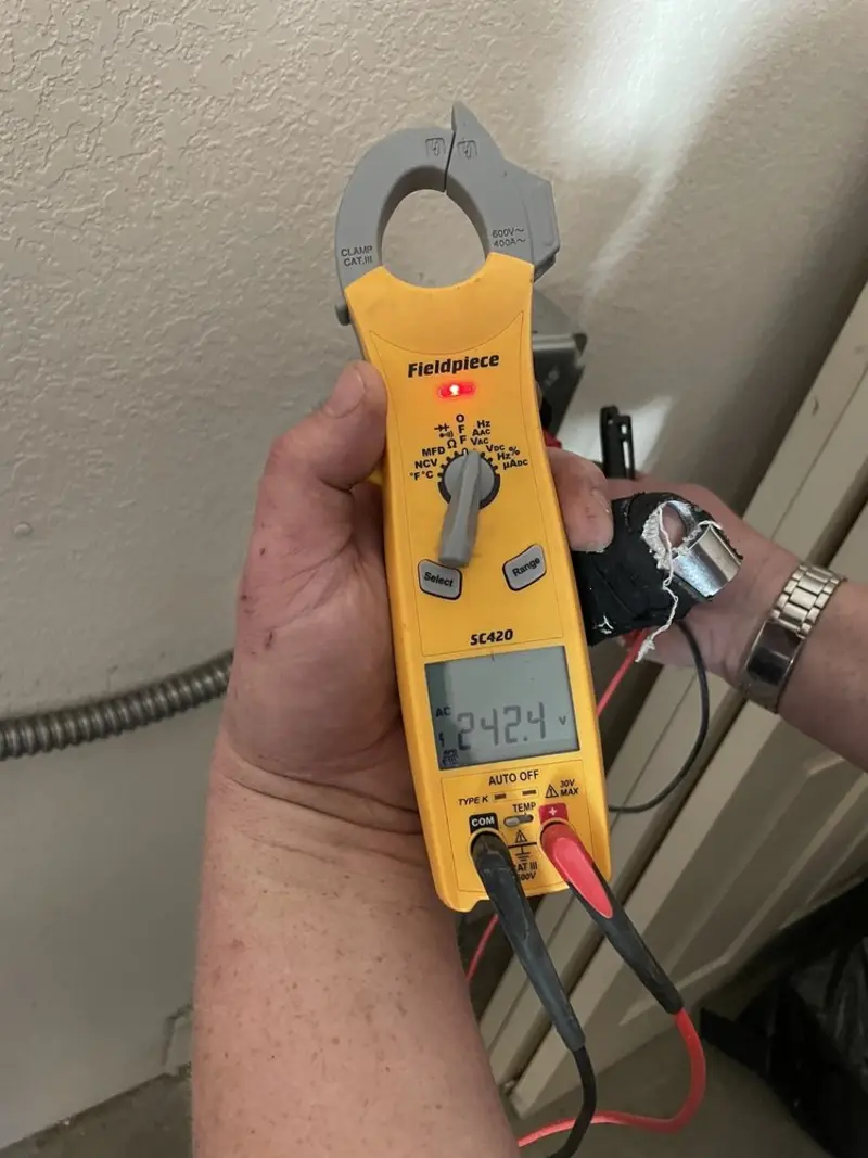 Voltage testing with clamp meter during Recessed Lighting Installation in Mooresville